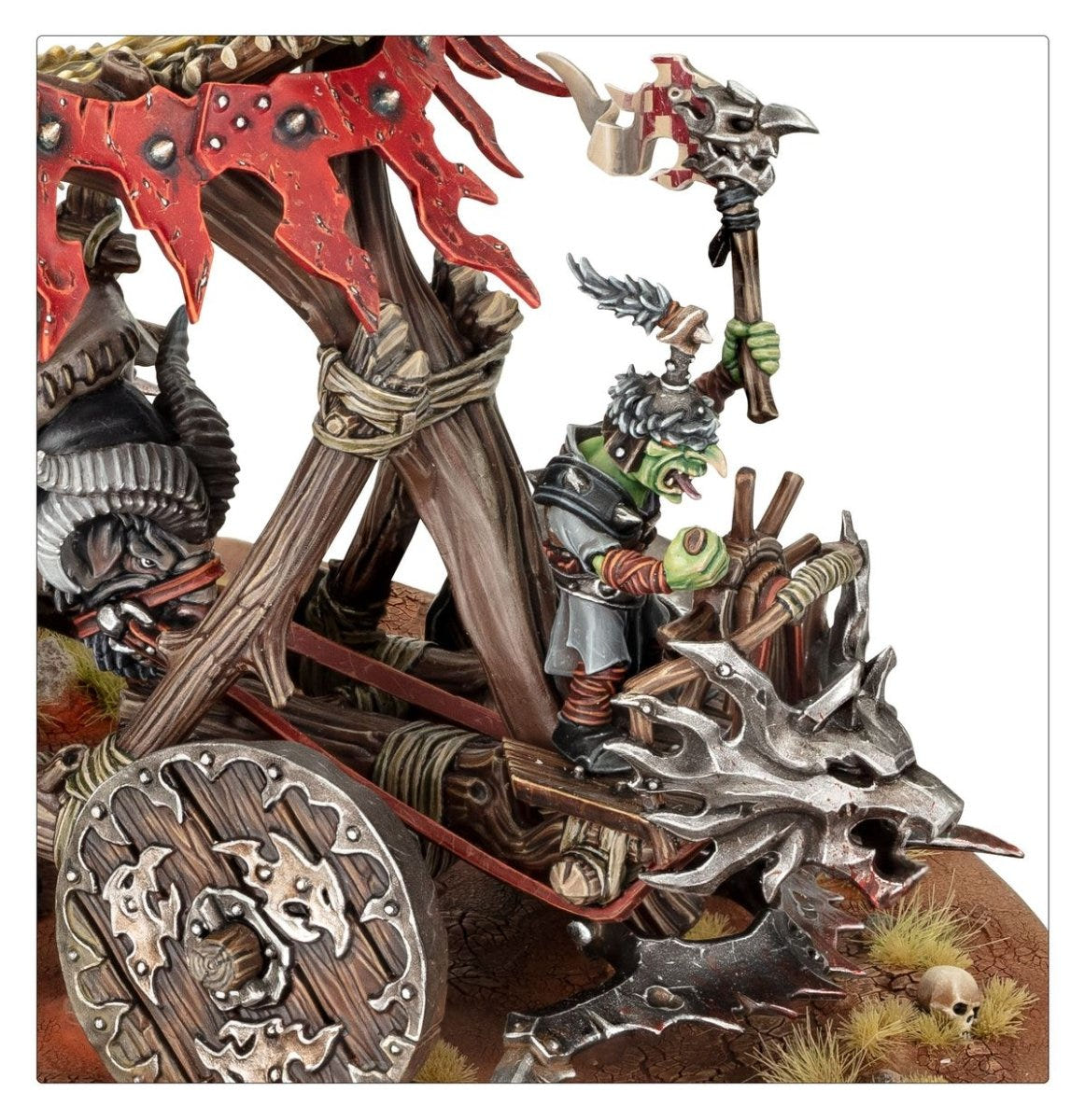 Close-up of a grot crewman with axe beside the Doom Diver Catapult's wooden wheel