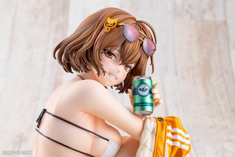 Close-up of Anis smiling with a soda can and sunglasses on her head