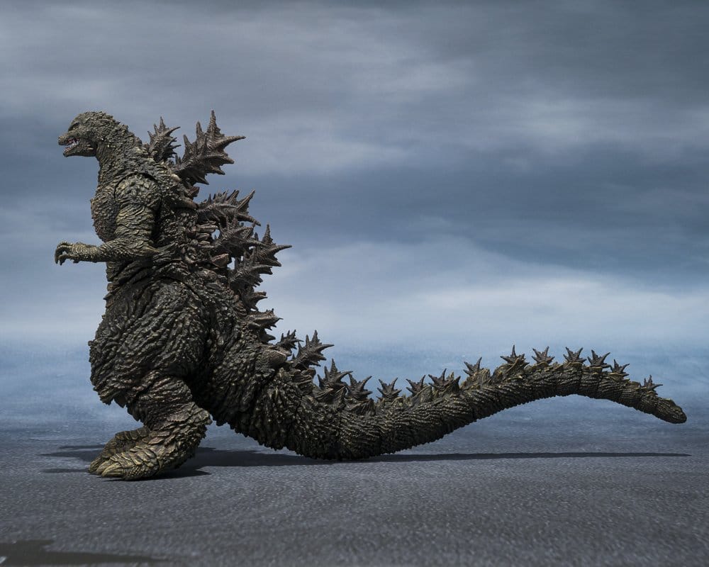 Godzilla the Ride S.H.MonsterArts figure in left side profile, showing dorsal spines and tail
