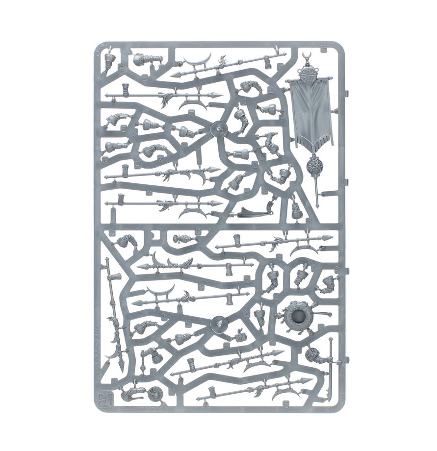A gray plastic sprue containing miniature weapon and armor components for model building, isolated on a white background.