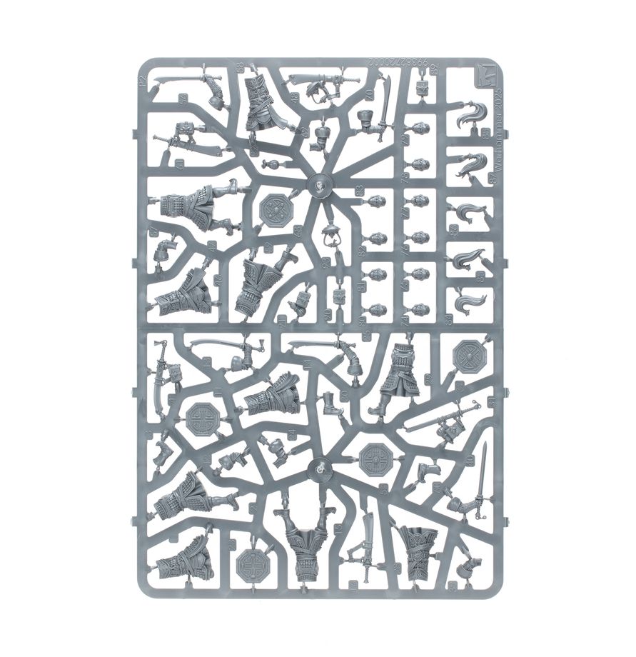 A gray plastic sprue containing multiple miniature model parts, isolated on a solid white background.