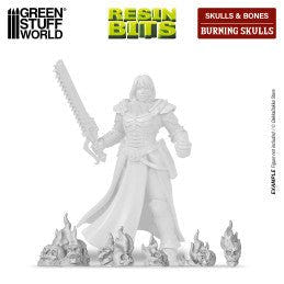 Green Stuff World Burning Skulls resin bits shown at the feet of an example miniature for scale