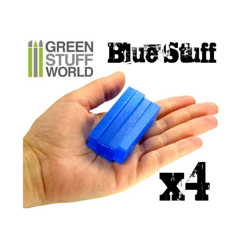 Hand holding four Green Stuff World Blue Stuff mould bars