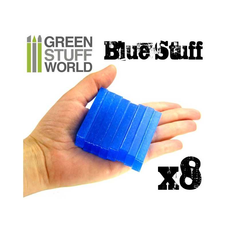 Hand holding a stack of eight Green Stuff World Blue Stuff mould bars