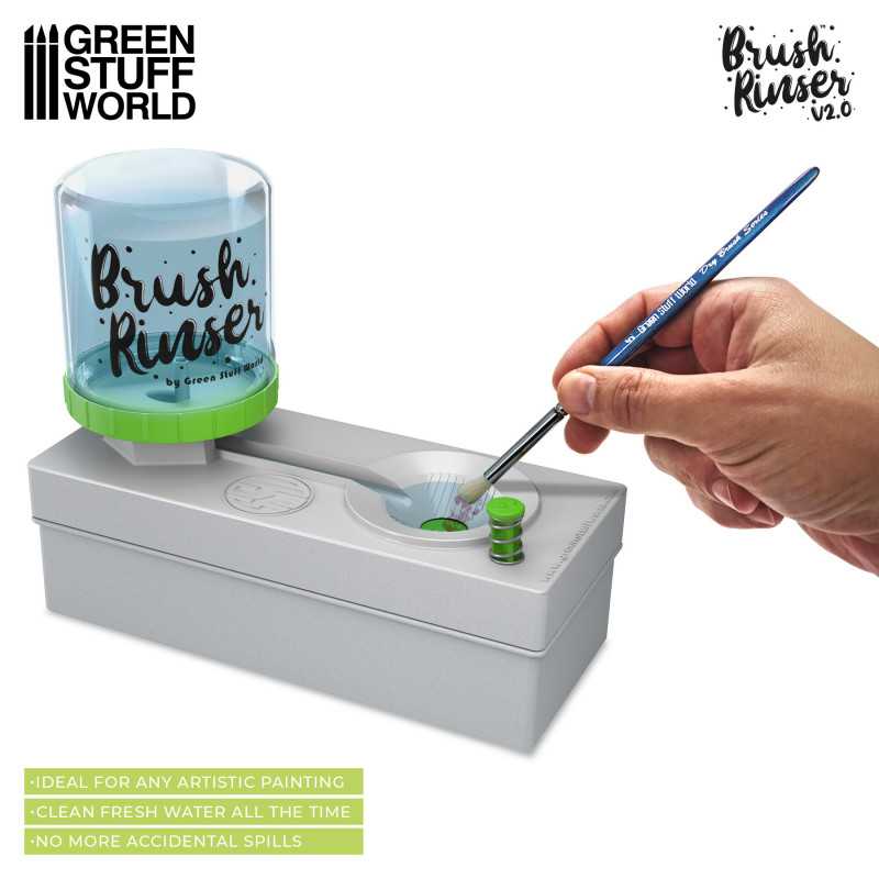 Hand rinsing a paintbrush in the Green Stuff World Brush Rinser well