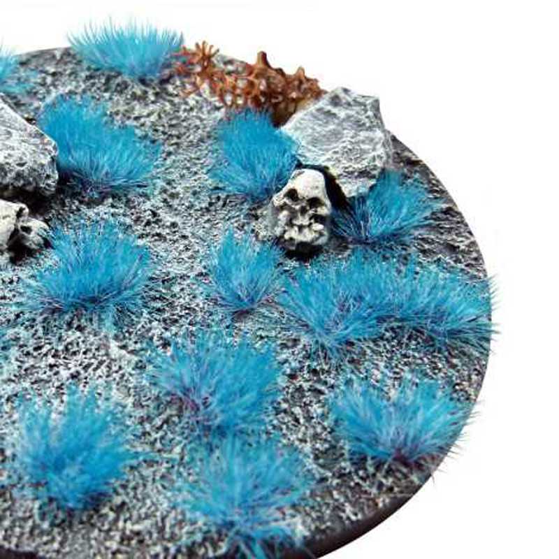 Green Stuff World Martian Fluor Tufts in Neon Stitch Blue on a rocky miniature base with skull