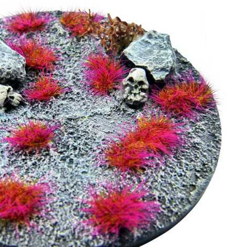 Base scattered with Green Stuff World Martian Fluor Tufts On Fire Purple, vivid pink-purple tufts
