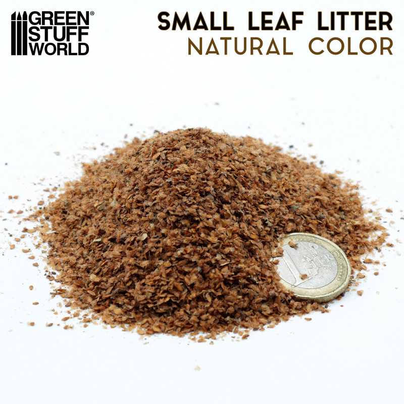Pile of Green Stuff World natural small leaf litter next to a coin for scale