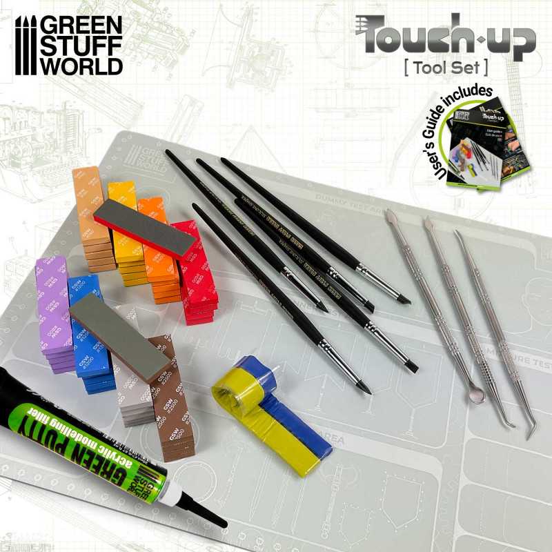 Green Stuff World Touch-up Tool Set laid out on a cutting mat with sanding pads, brushes and tools