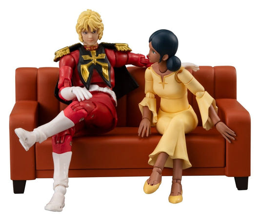 Gundam G.M.G. Collection EX Newtype Awakening Char and Lalah figures seated on a red sofa