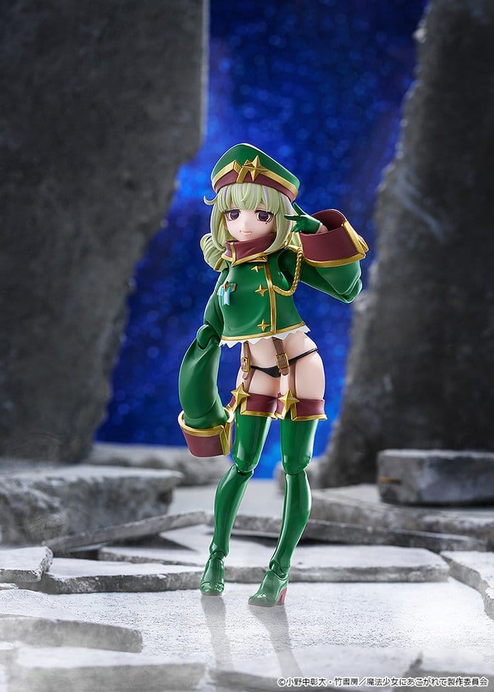 figma Leopard posed on a rocky backdrop with dark blue sky behind