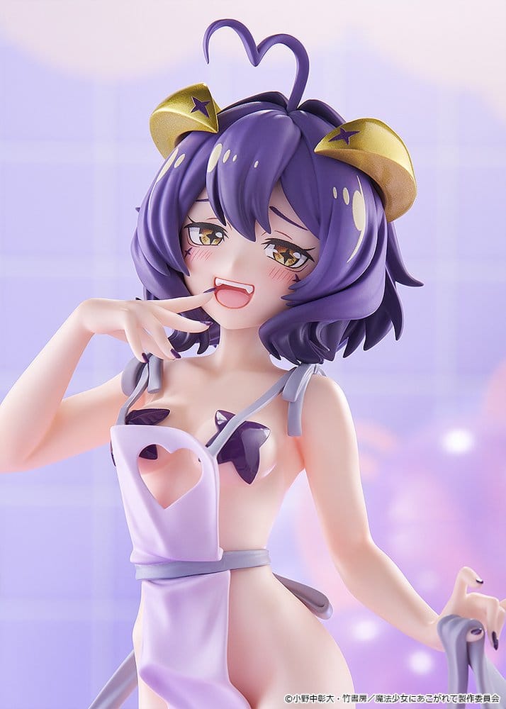 Close-up of Magia Baiser figure's face, purple hair, gold horns and heart-shaped ahoge