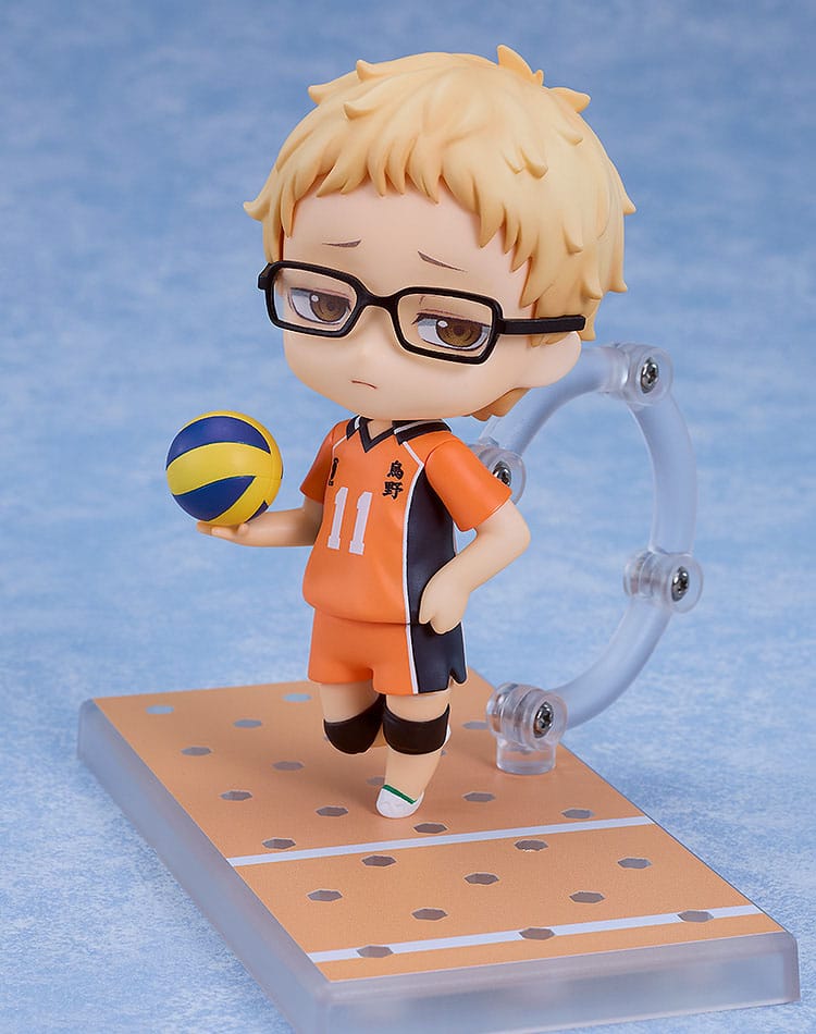 Kei Tsukishima Nendoroid holding a volleyball with an exasperated face on the court base