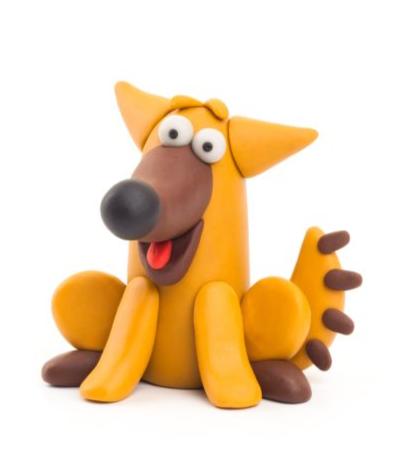 Finished Hey Clay Doggie model, a yellow and brown clay dog with tongue out