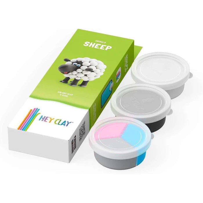 Hey Clay Sheep box beside its three cans of white, black and coloured clay