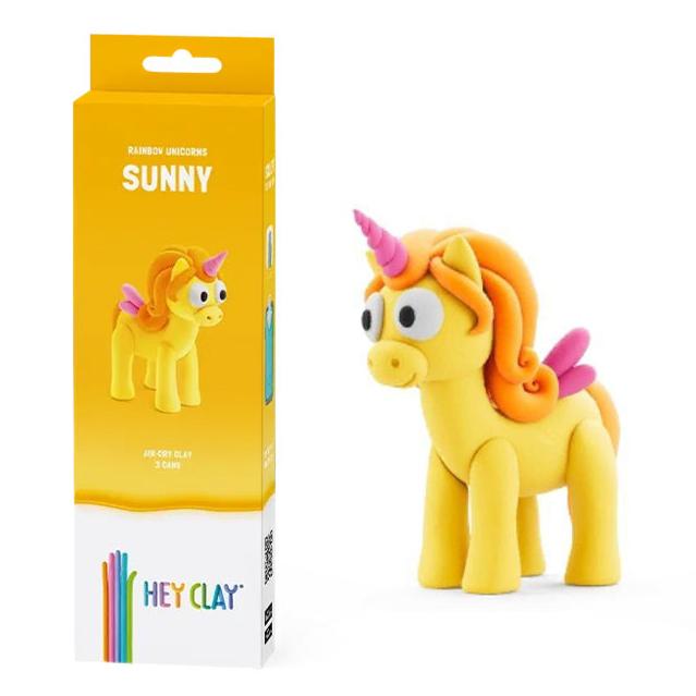 Hey Clay Unicorn Claymates Sunny box beside the finished yellow clay unicorn with orange mane