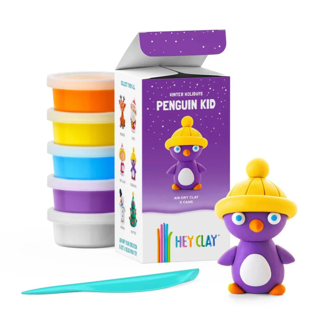 TOMY Hey Clay Winter Holidays Penguin kit: five clay cans, box and finished purple penguin in yellow hat