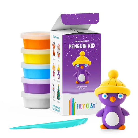TOMY Hey Clay Winter Holidays Penguin kit: five clay cans, box and finished purple penguin in yellow hat