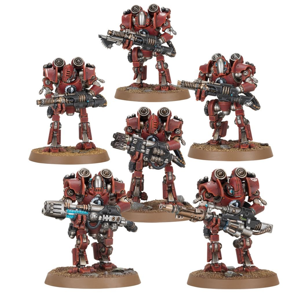 Six painted Mechanicum robots in red armour carrying heavy guns