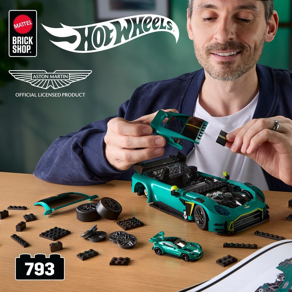 Man building the Mattel Brick Shop Hot Wheels Elite Aston Martin Vantage GT3 at a table