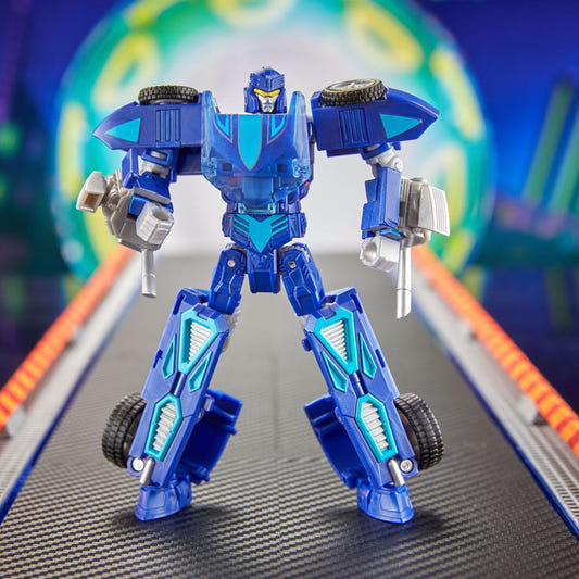 Hot Wheels x Transformers Twin Mill figure in blue robot mode on a race track backdrop