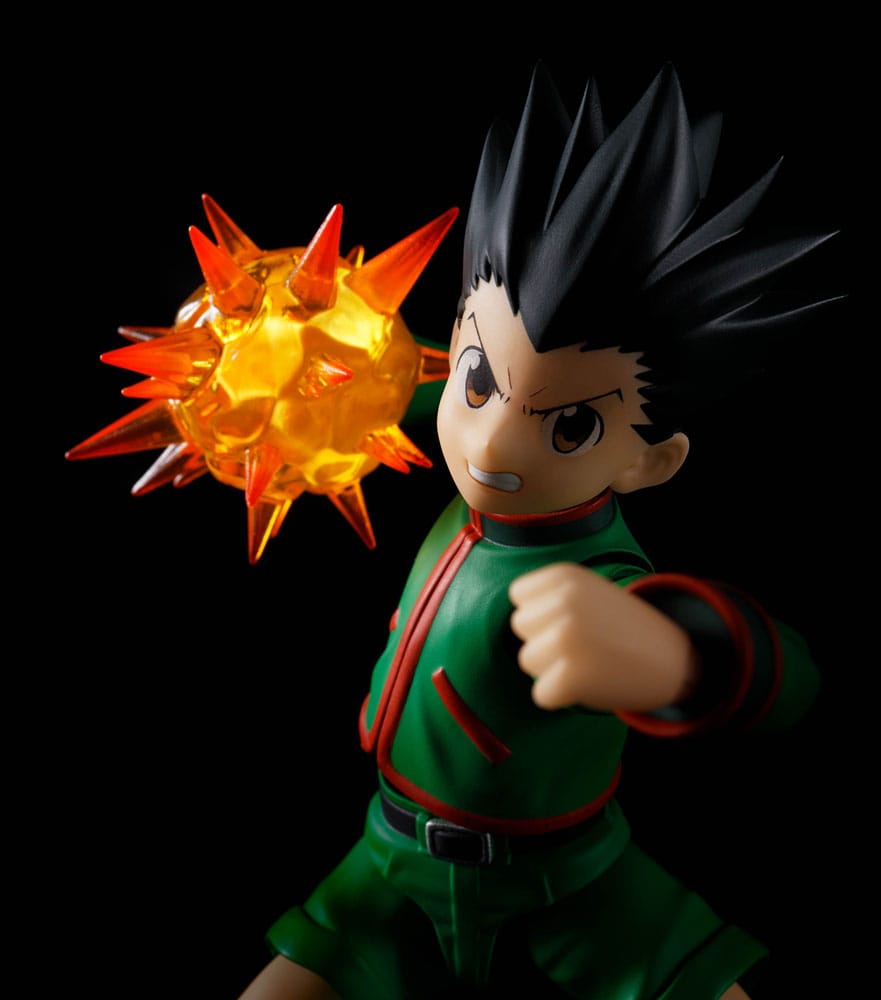 Gon S.H.Figuarts figure with orange Nen burst effect on his fist, close-up against black