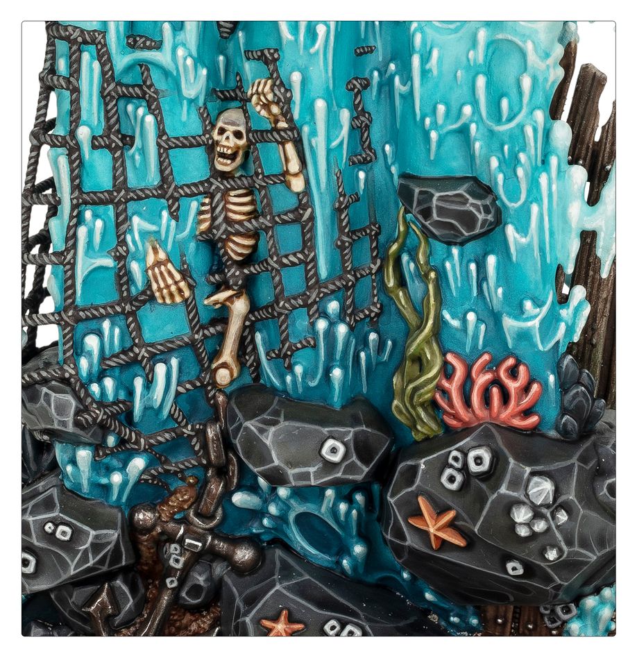 Close-up of the Idoneth Deepkin Manifestation shipwreck with skeleton in rigging, coral and rocks