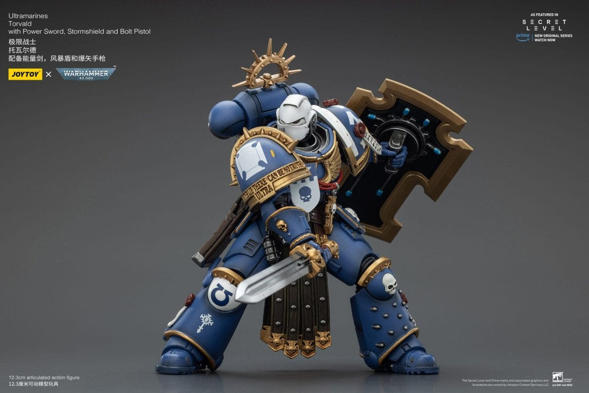 Joy Toy Warhammer 40k Ultramarines Torvald slashing with power sword, stormshield raised behind
