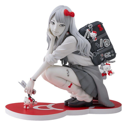 Good Smile Company Gyaru Tomie x Hello Kitty figure crouching on red heart-shaped base with backpack