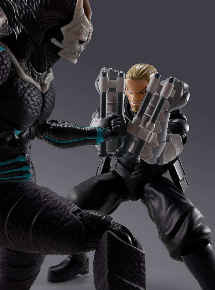 Isao Shinomiya S.H.Figuarts figure squaring up to a black kaiju figure, close-up