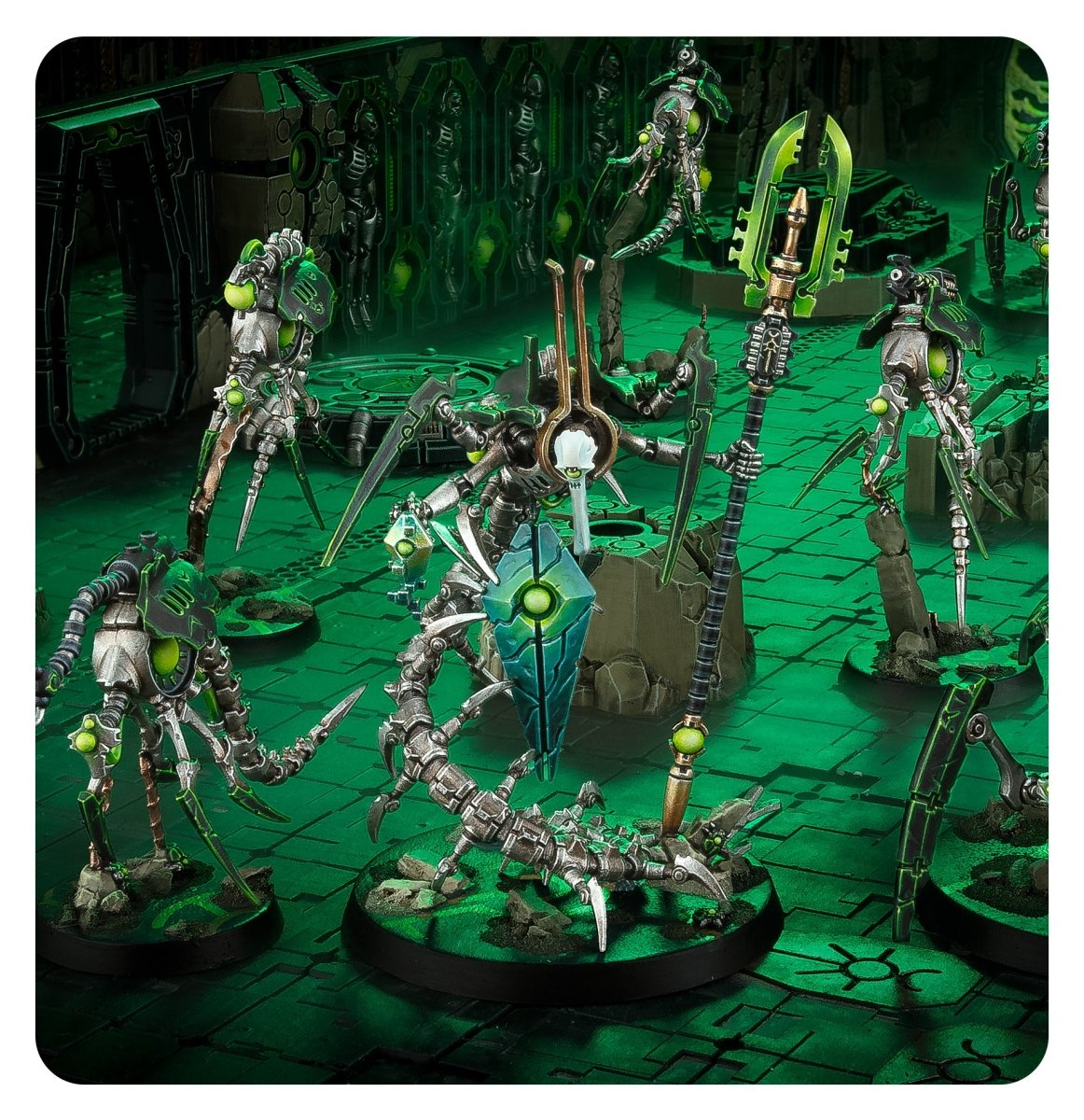 Painted Canoptek Circle kill team advancing through a green-lit Necron tomb scene, Games Workshop