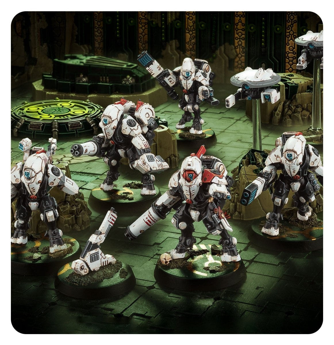 XV26 Stealth Battlesuits kill team advancing across a dark green battlefield