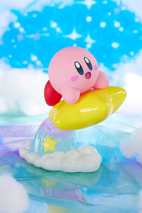 Pop Up Parade Kirby on Warp Star with starry trail, shown against a sky backdrop