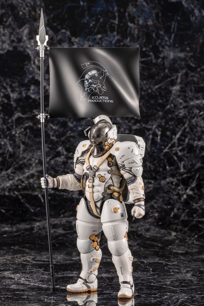 Ludens model kit standing with Kojima Productions flag on a dark marble backdrop