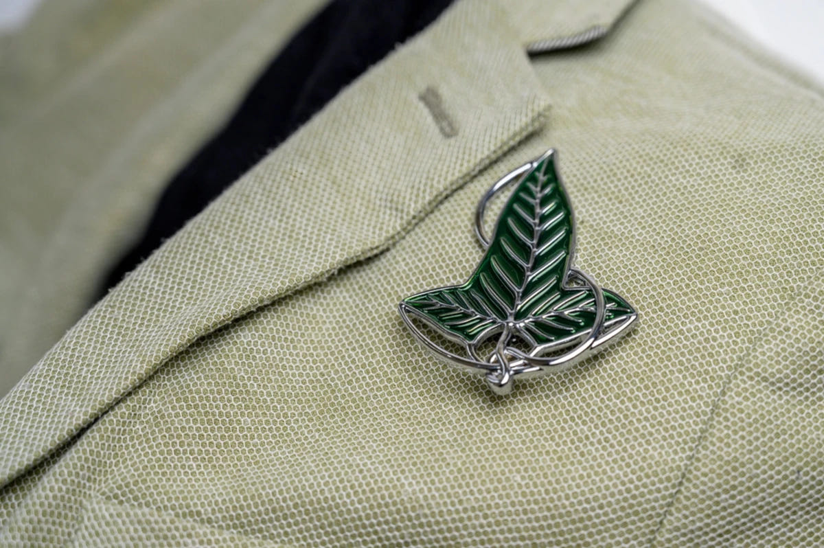 Lord of the Rings Elven Leaf Brooch replica pinned to a pale green linen jacket lapel