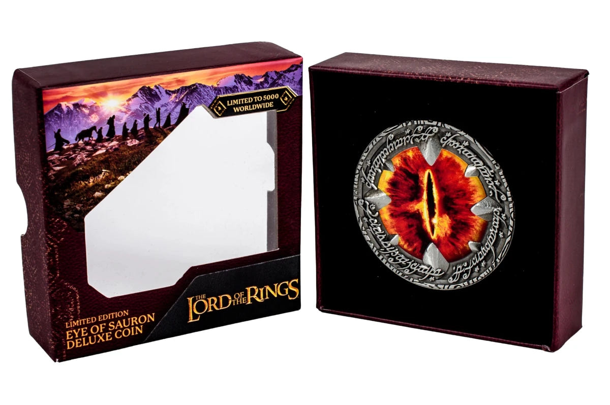 Eye of Sauron Deluxe Coin in its presentation case beside the open gift box sleeve
