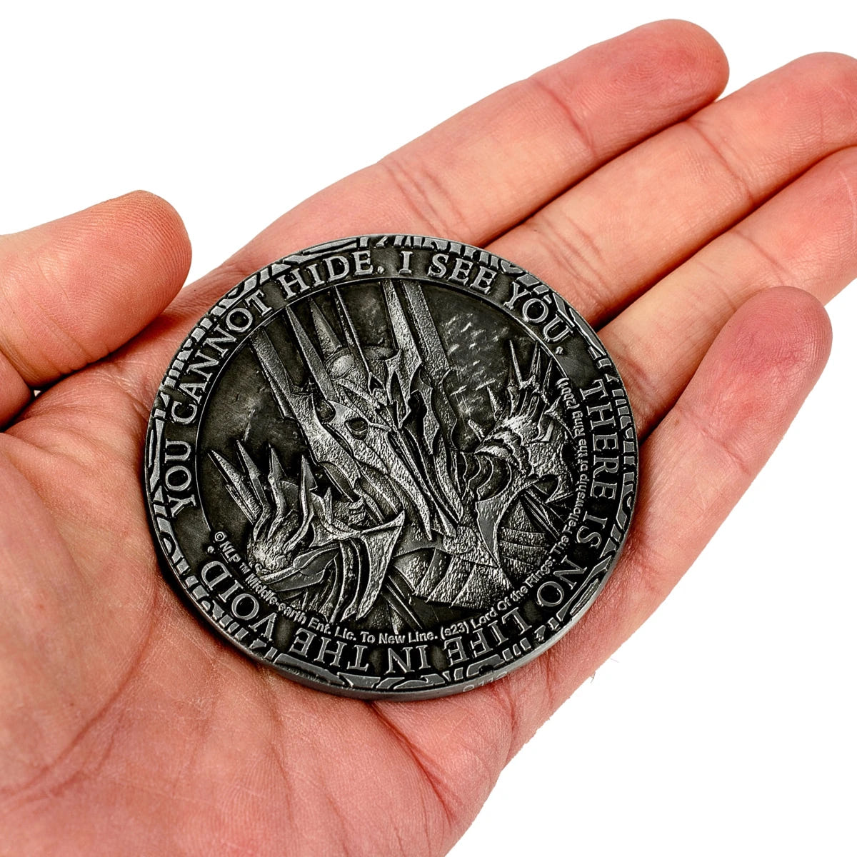 Lord of the Rings Sauron coin reverse resting in an open palm