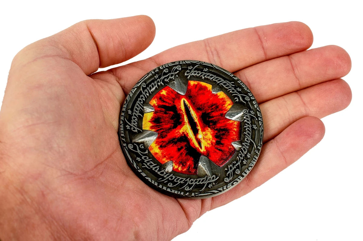 Eye of Sauron Deluxe Coin resting in an open palm to show its size