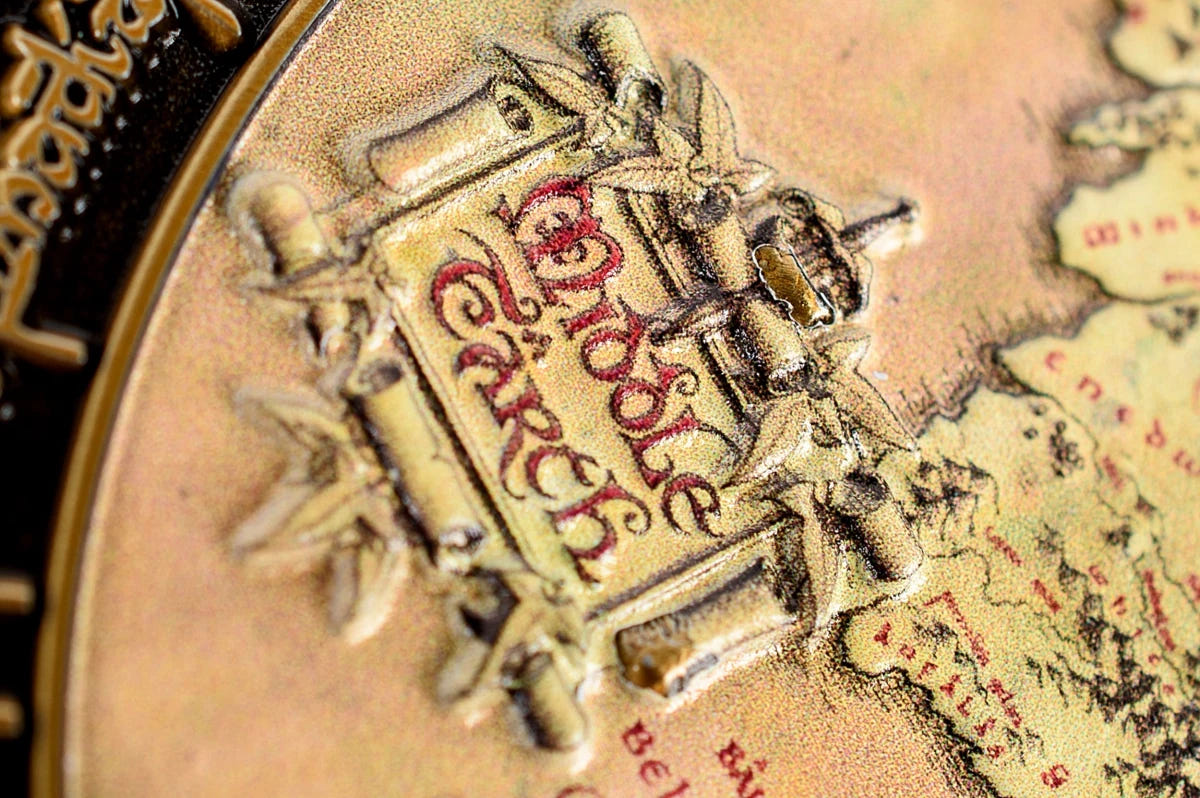 Close-up of the Middle-earth title cartouche on the deluxe map coin