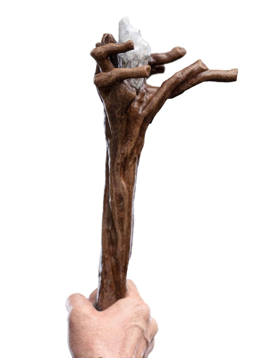Close-up of the gnarled wooden staff held by the Gandalf the Grey mini statue