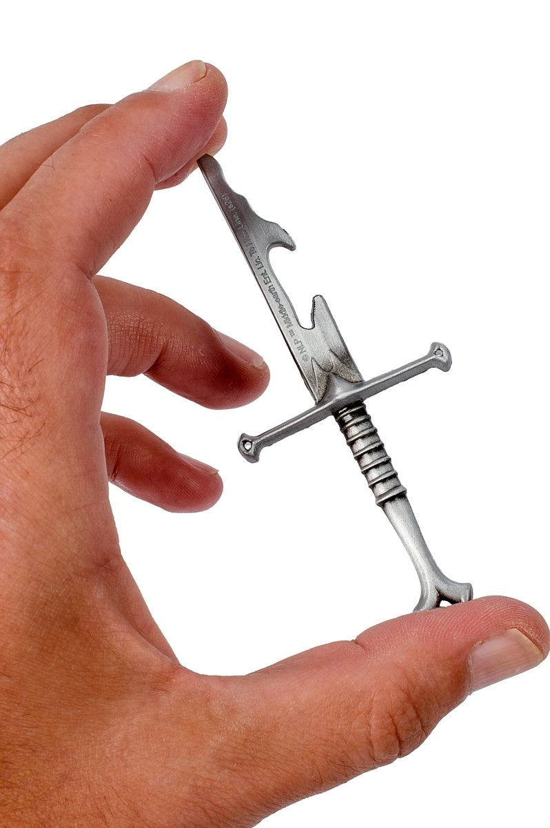 Narsil bottle opener held between finger and thumb