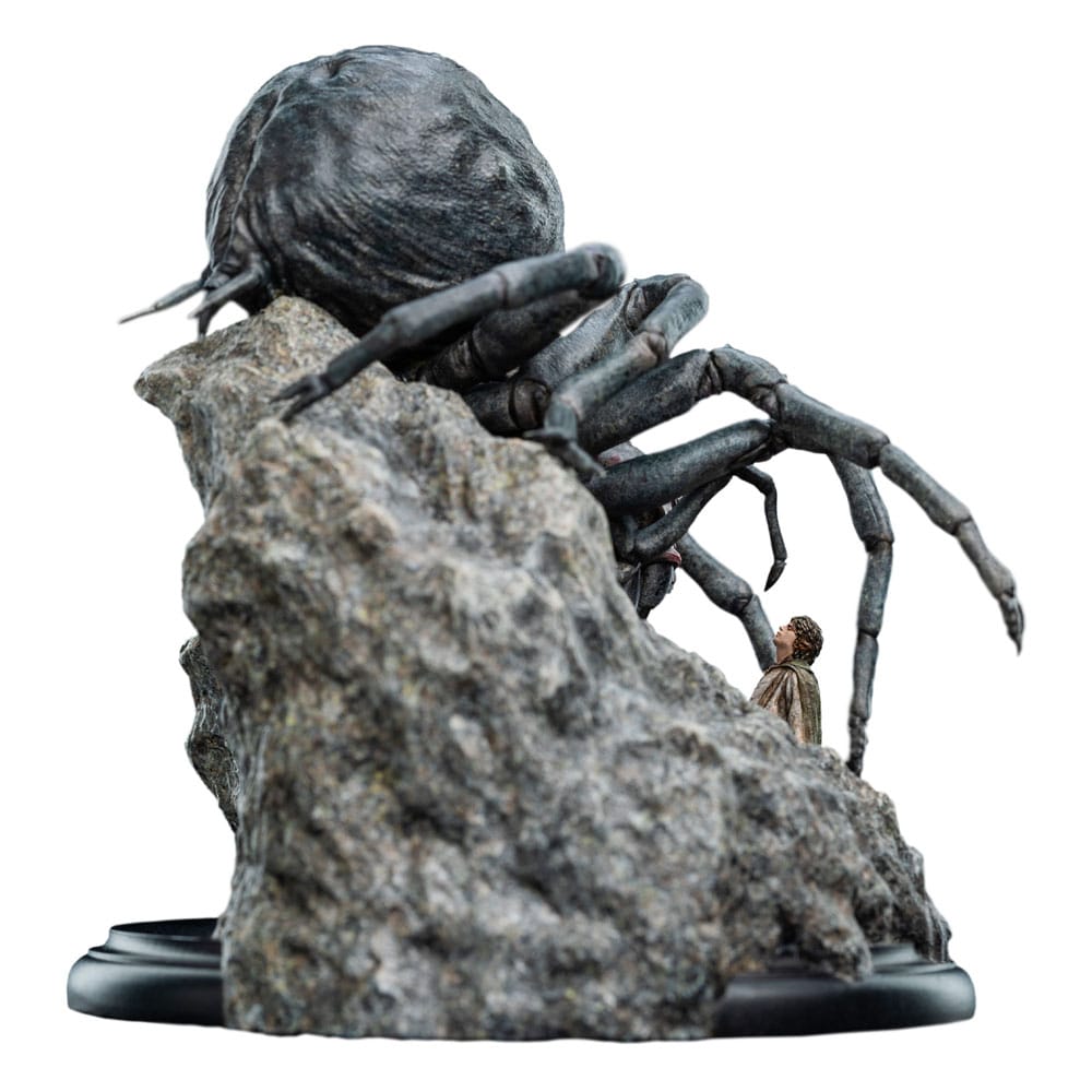 Shelob statue from the right side with the hobbit peering around the rock