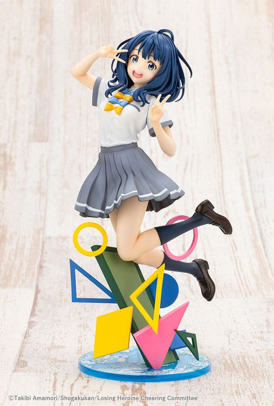 Kotobukiya Makeine Anna Yanami 1/7 statue in a jumping pose on a colourful geometric base
