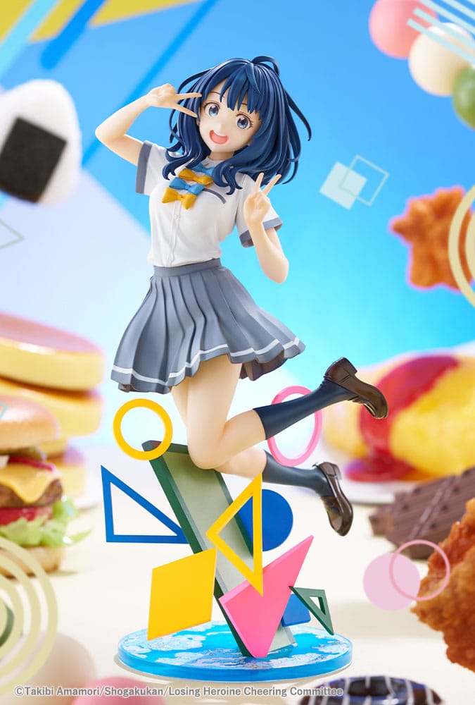 Anna Yanami statue jumping in front of a bright food-themed backdrop