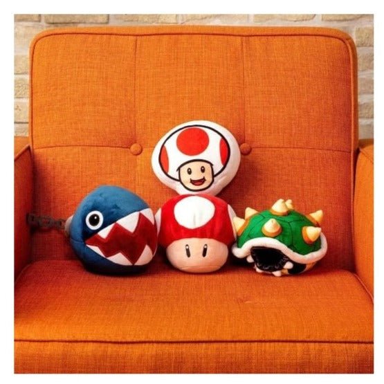 TOMY Mocchi-Mocchi Mario plushes lined up on an orange sofa