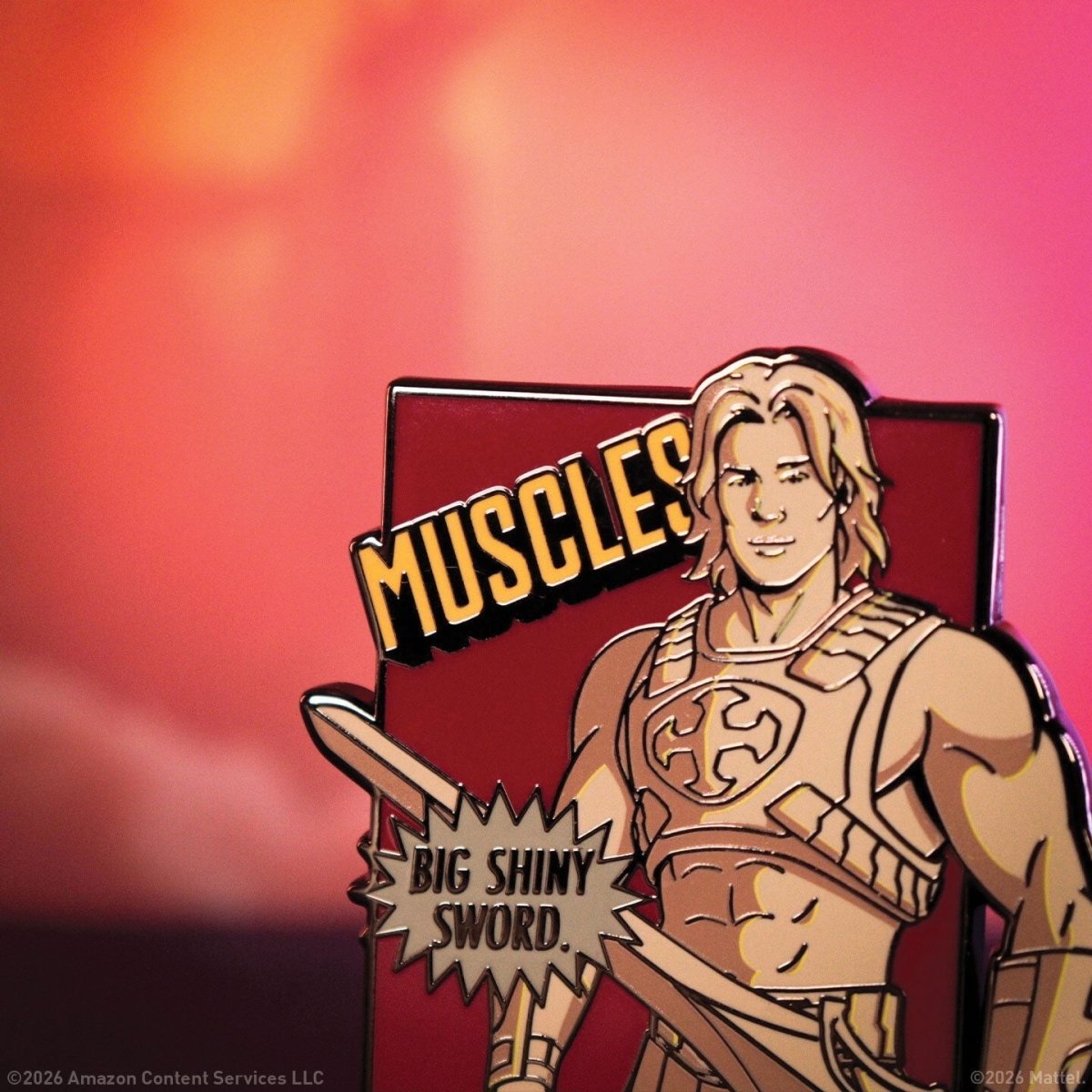 Close-up of the Fanattik He-Man pin badge showing He-Man holding his sword