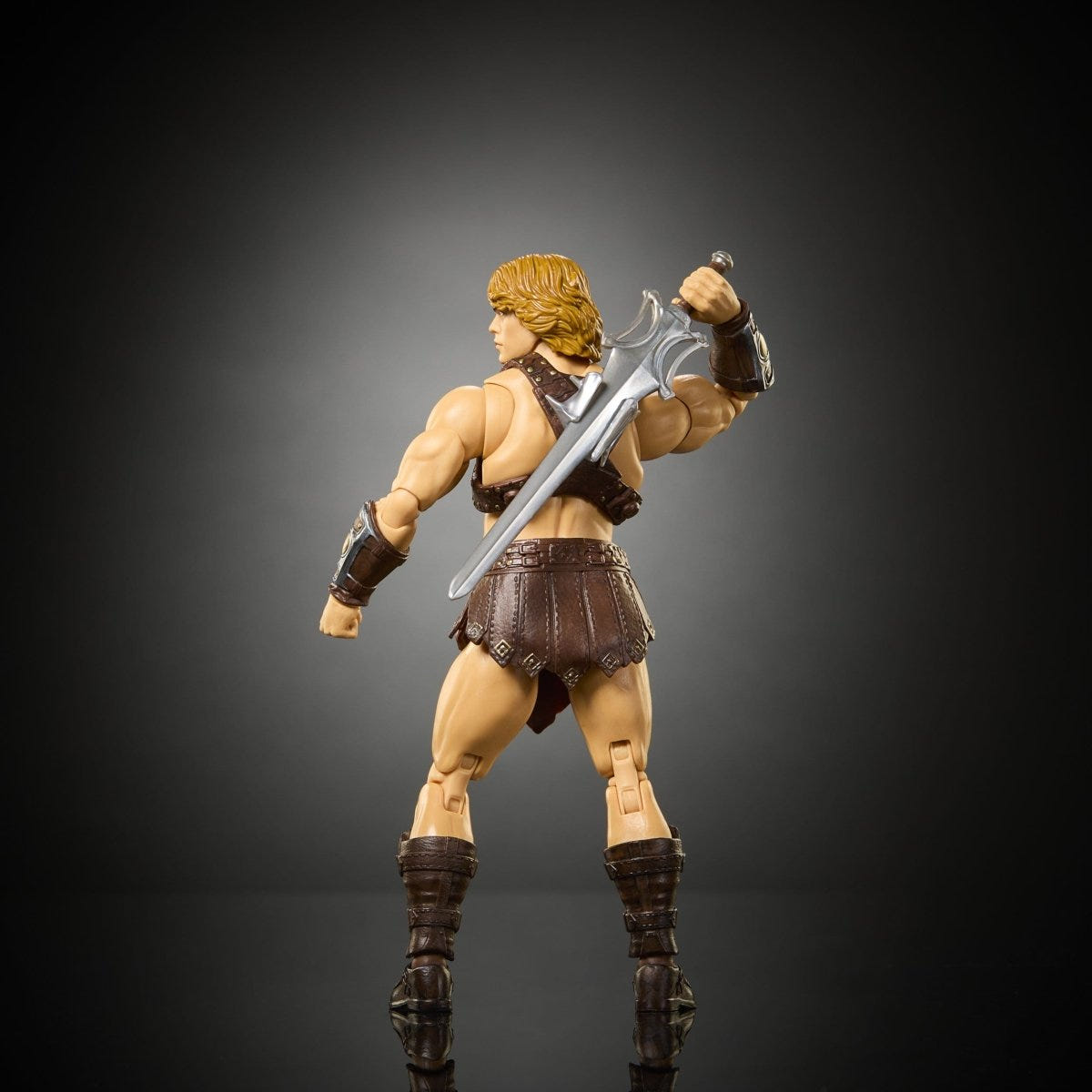 He-Man Movie Chronicles figure rear view showing harness with sword resting on shoulder