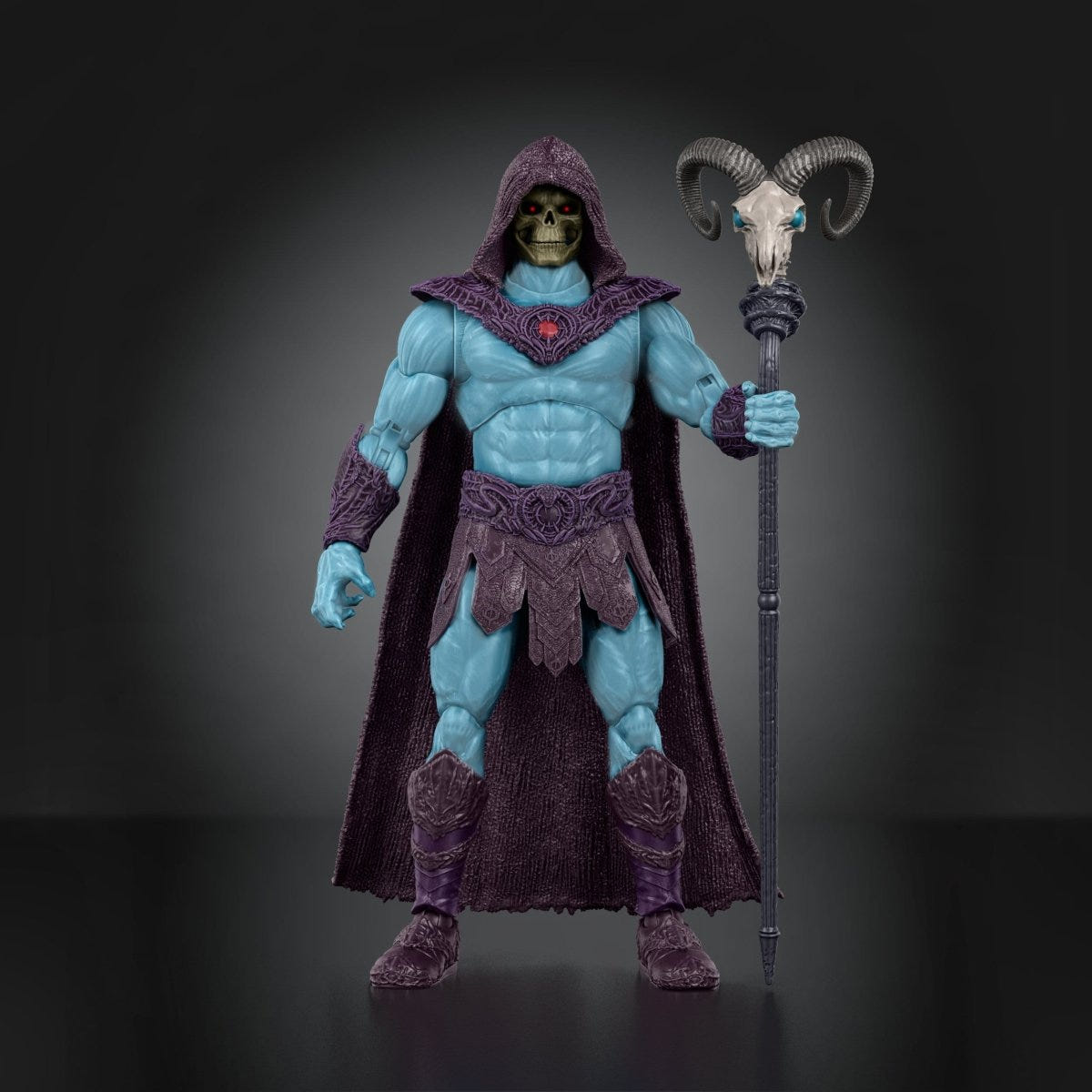 Skeletor figure standing upright holding the ram-skull staff at his side