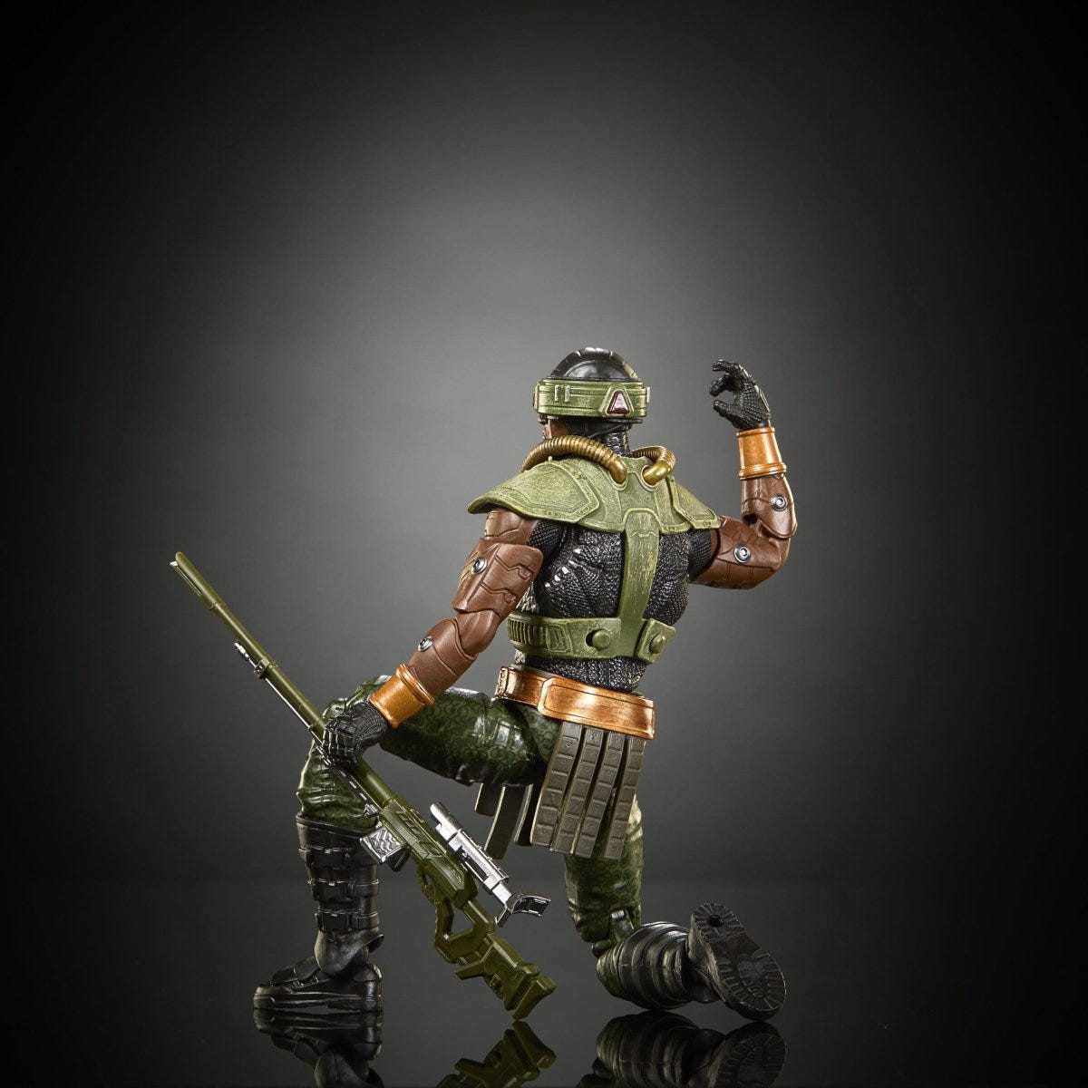 Mattel Tri-Klops figure crouching on one knee with his rifle