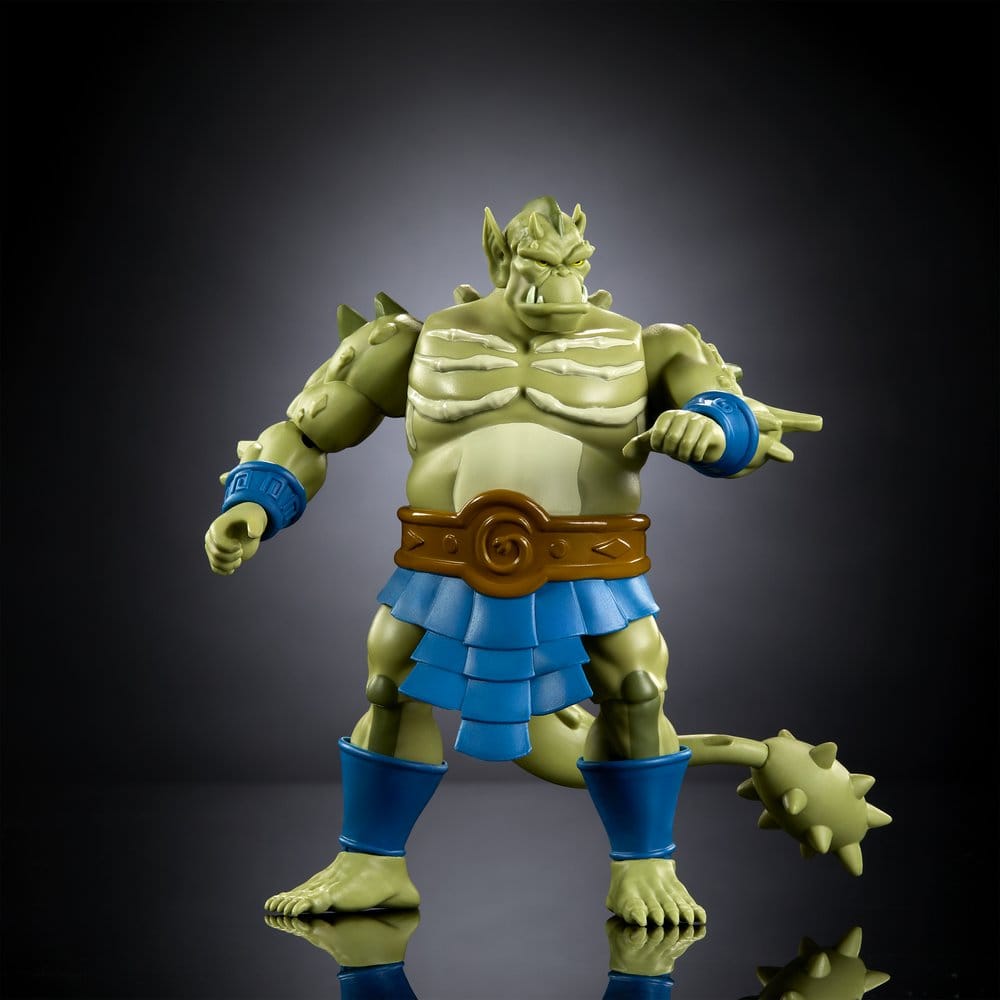 Masters of the Universe Origins Whiplash figure posed with spiked tail showing, dark backdrop